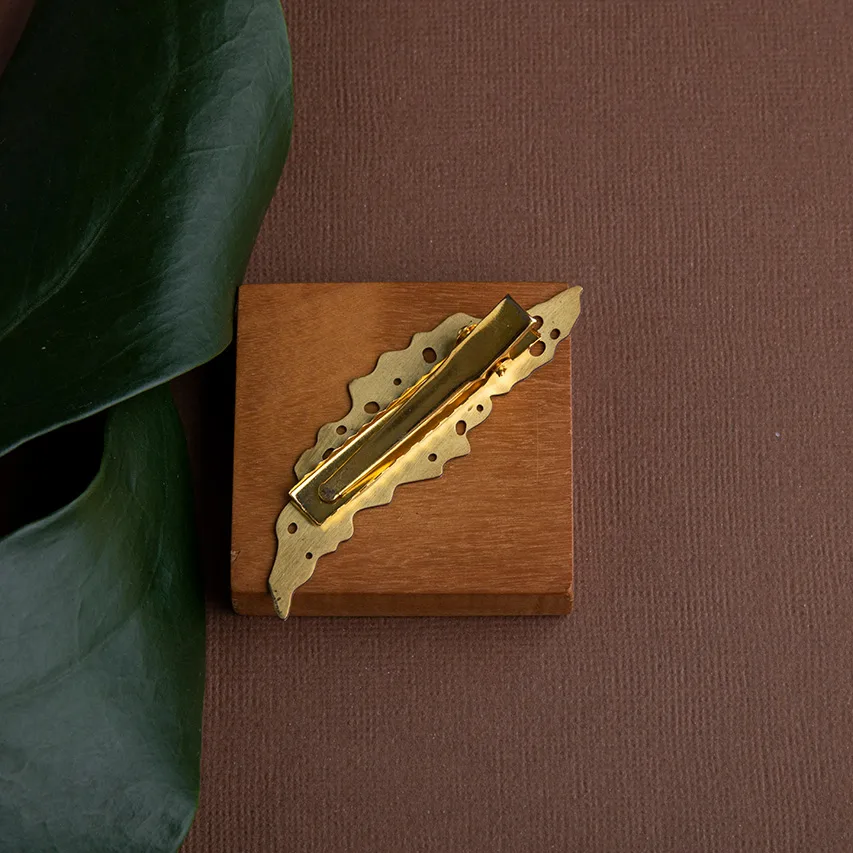 Fermacapelli in ottone