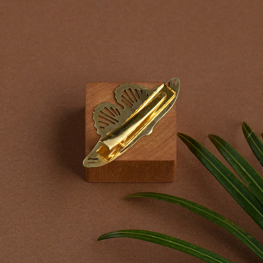 Fermacapelli in ottone