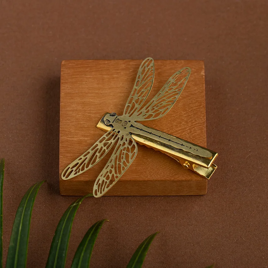 Fermacapelli in ottone